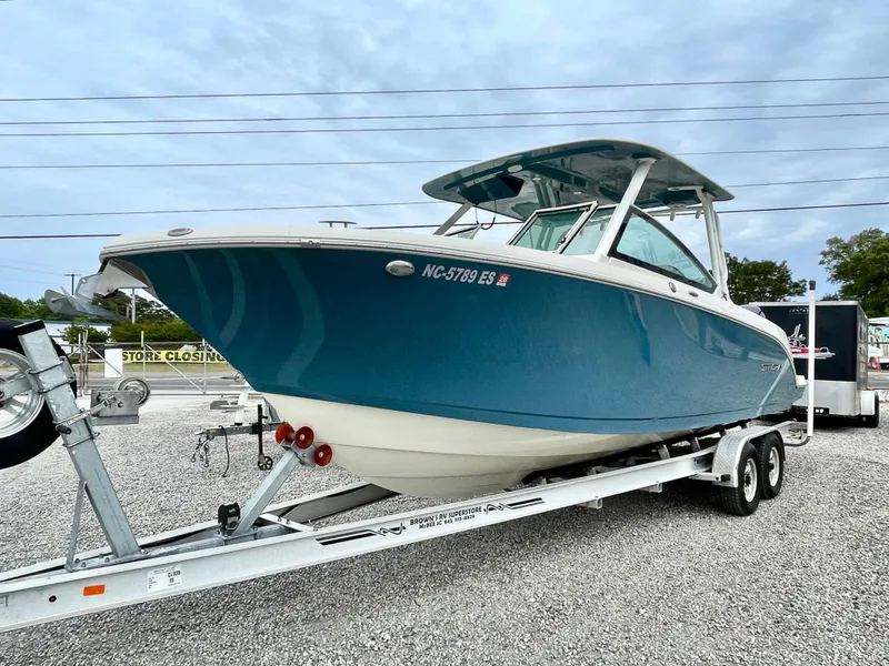 Slide: The Image of 2020 Stingray 269 DC boat on trailer, blue design. - 2