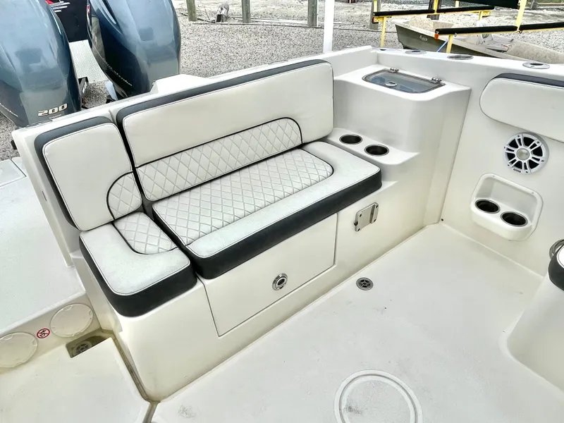 Slide: The Image of Interior of a 2020 Stingray 269 DC boat with cushioned seating. - 22