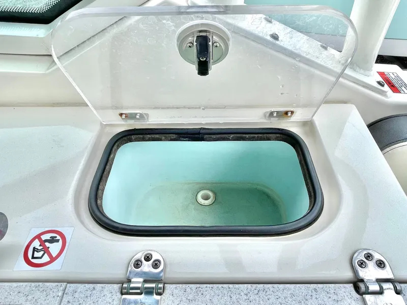Slide: The Image of Stingray 269 DC 2020 boat compartment with open lid. - 27