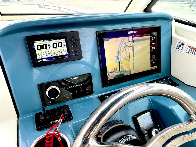 Slide: The Image of Dashboard of 2020 Stingray 269 DC boat with navigation system. - 45