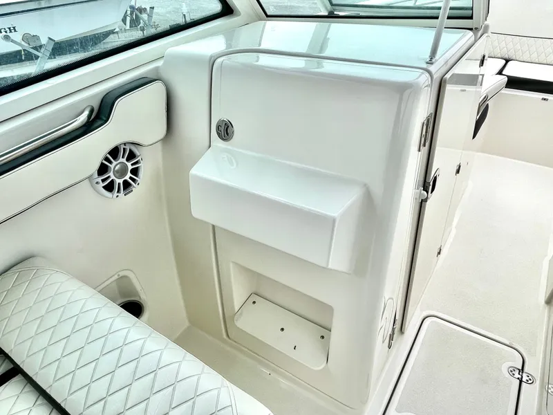 Slide: The Image of Interior of a 2020 Stingray 269 DC boat with seat and speaker. - 47