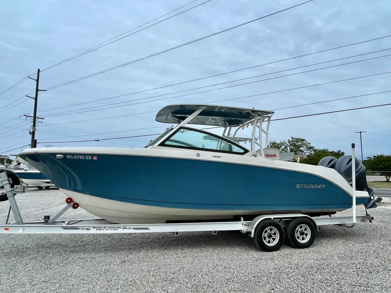 Slide: The Image of 2020 Stingray 269 DC boat on trailer, side view. - 5