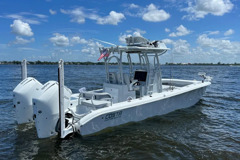 The Image of 2020 Costa Custom Boats 264 HC on water, featuring dual Mercury engines and sleek design. - 0