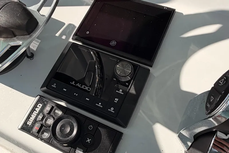 Slide: The Image of Control panel of 2020 Costa Custom Boats 264 HC with JL Audio and Simrad systems. - 10