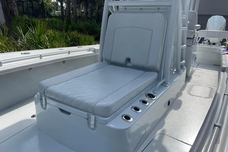 Slide: The Image of 2020 Costa Custom Boats 264 HC interior seating with sleek design and rod holders. - 11