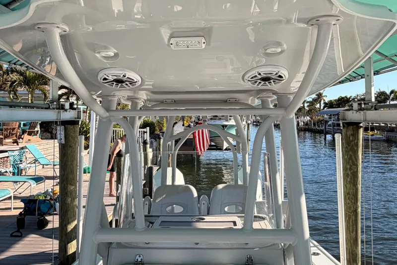 Slide: The Image of 2020 Costa Custom Boats 264 HC docked, showcasing interior and waterfront view. - 17