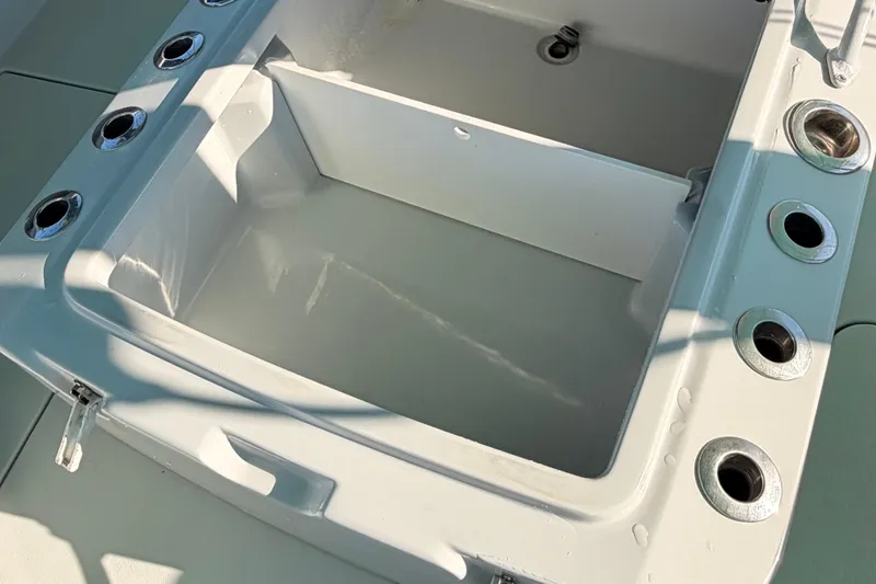 Slide: The Image of Livewell on 2020 Costa Custom Boats 264 HC, featuring multiple rod holders. - 21