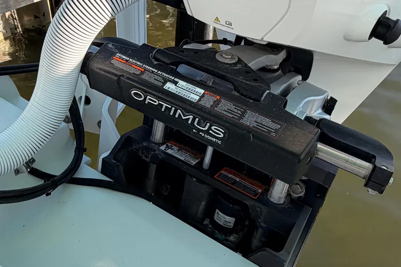 Slide: The Image of Optimus steering actuator on 2020 Costa Custom Boats 264 HC, featuring advanced marine technology. - 25