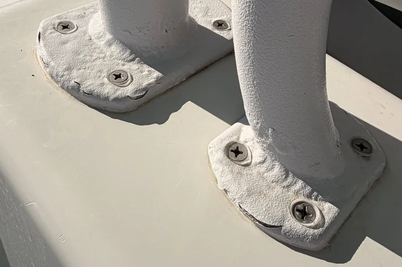 Slide: The Image of Close-up of a 2020 Costa Custom Boats 264 HC deck fitting with screws. - 26