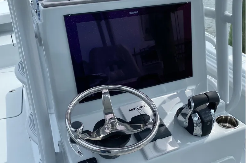 Slide: The Image of Helm of 2020 Costa Custom Boats 264 HC with steering wheel and controls. - 7