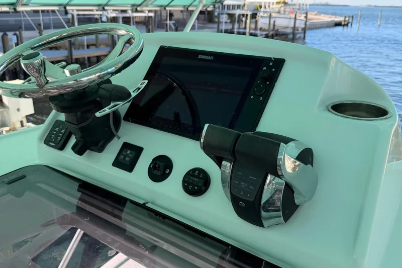 Slide: The Image of Helm of 2020 Costa Custom Boats 264 HC with steering wheel and controls. - 8