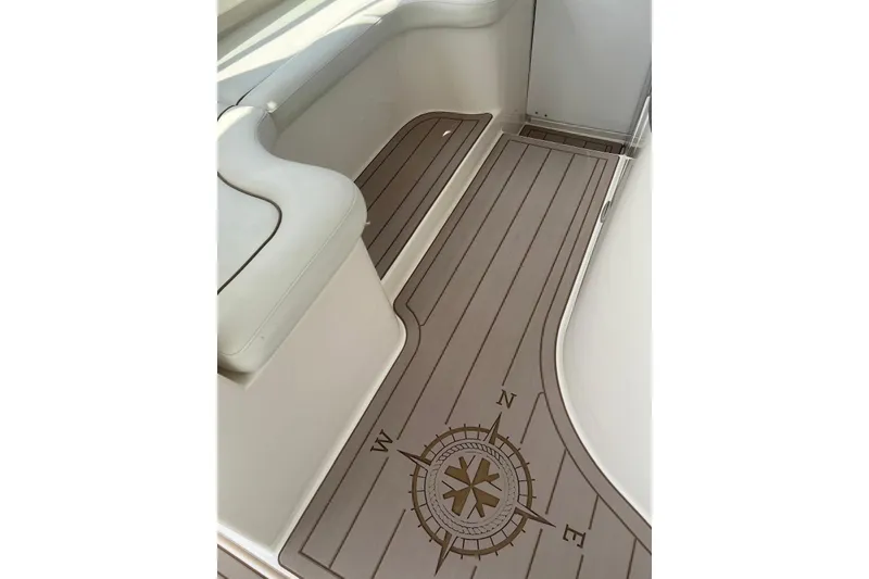 Slide: The Image of 2005 Rinker Fiesta Vee 320 boat interior with compass design flooring. - 21
