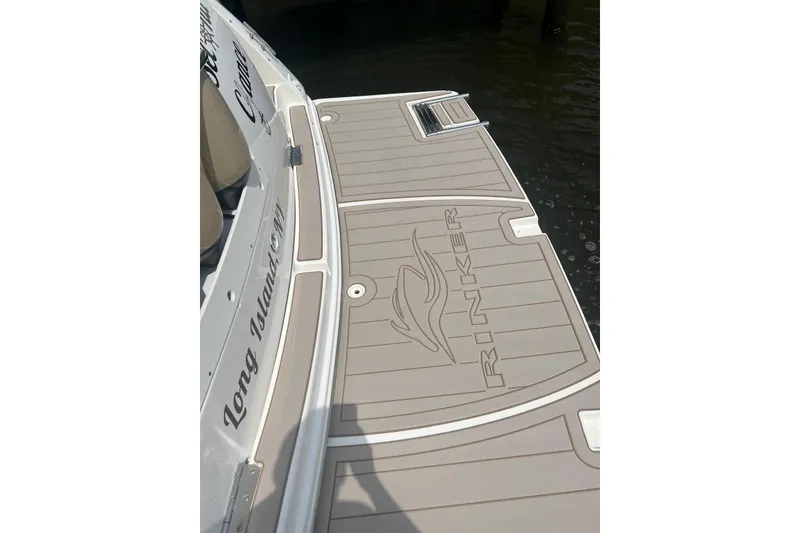 Slide: The Image of 2005 Rinker Fiesta Vee 320 boat deck with logo, docked at Long Island, NY. - 22