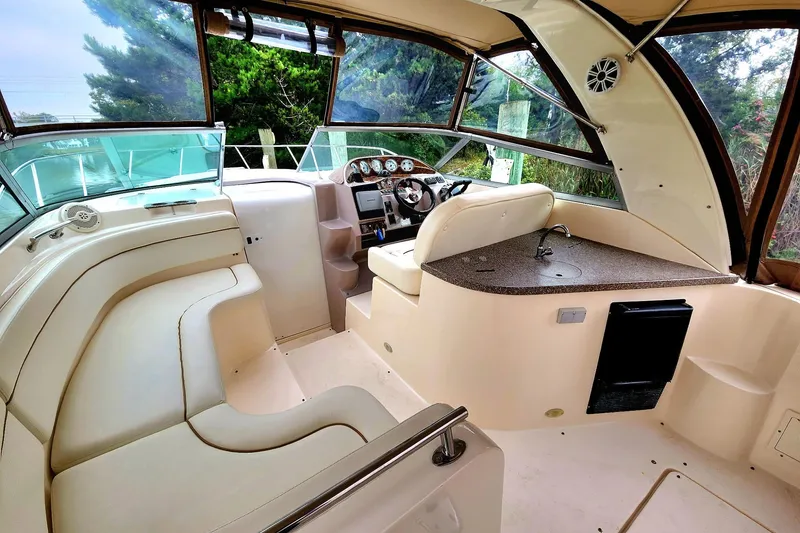 Slide: The Image of 2005 Rinker Fiesta Vee 320 boat interior with helm, seating, and dashboard. - 3
