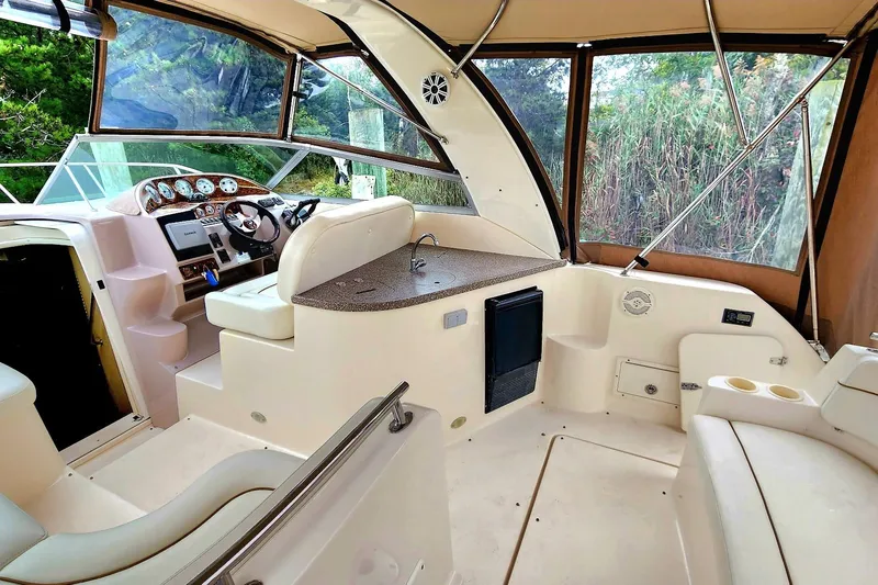 Slide: The Image of 2005 Rinker Fiesta Vee 320 boat interior with helm, seating, and dashboard. - 8