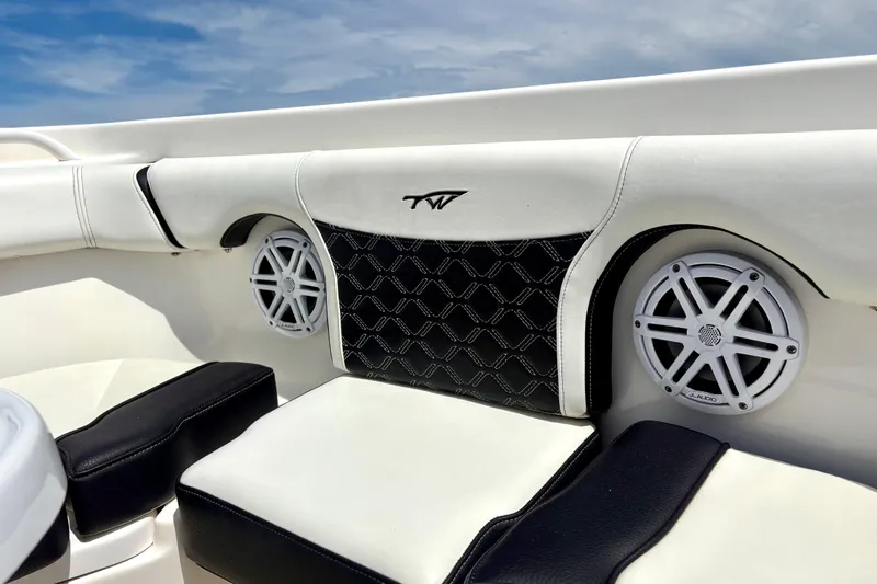 Slide: The Image of 2021 Tidewater 256 CC Adventure boat interior with stylish seating and JL Audio speakers. - 12