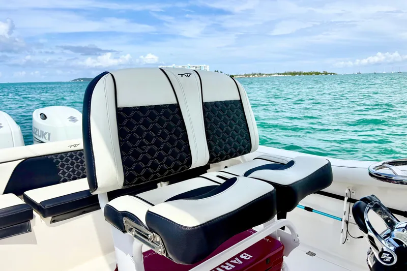 Slide: The Image of 2021 Tidewater 256 CC Adventure boat interior with stylish seating and ocean view. - 17