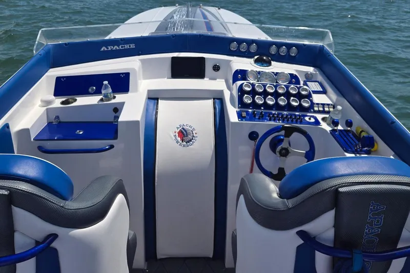 Slide: The Image of Cockpit of 1989 Apache 41 "The Chief" powerboat with blue and white interior. - 3