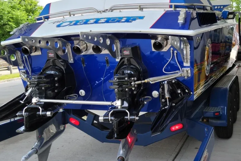 Slide: The Image of Rear view of a 1989 Apache 41 "The Chief" powerboat on a trailer. - 8