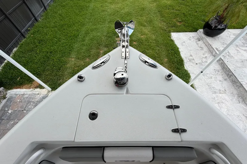 Slide: The Image of Bow view of 2016 Sea Hunt Gamefish 25 boat, featuring anchor and deck details. - 31