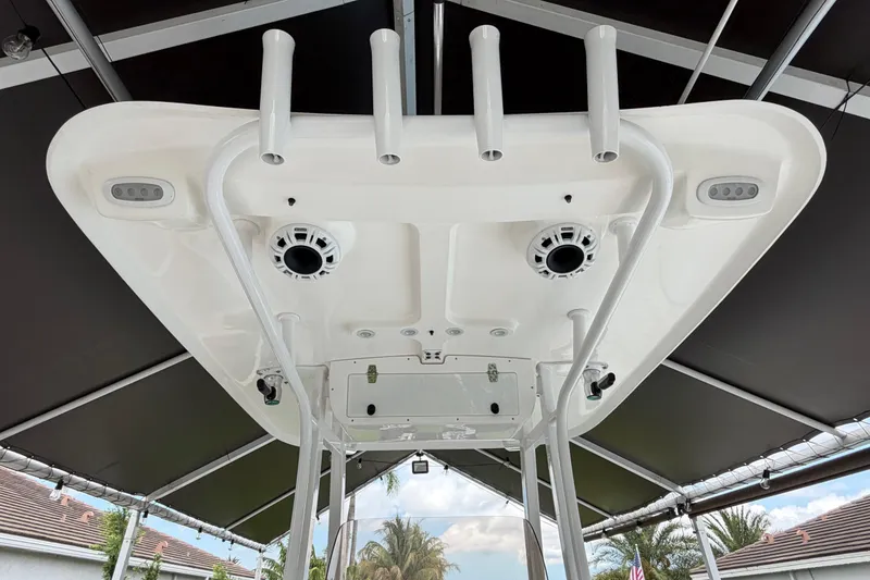 Slide: The Image of 2016 Sea Hunt Gamefish 25 boat's T-top with rod holders and speakers. - 34