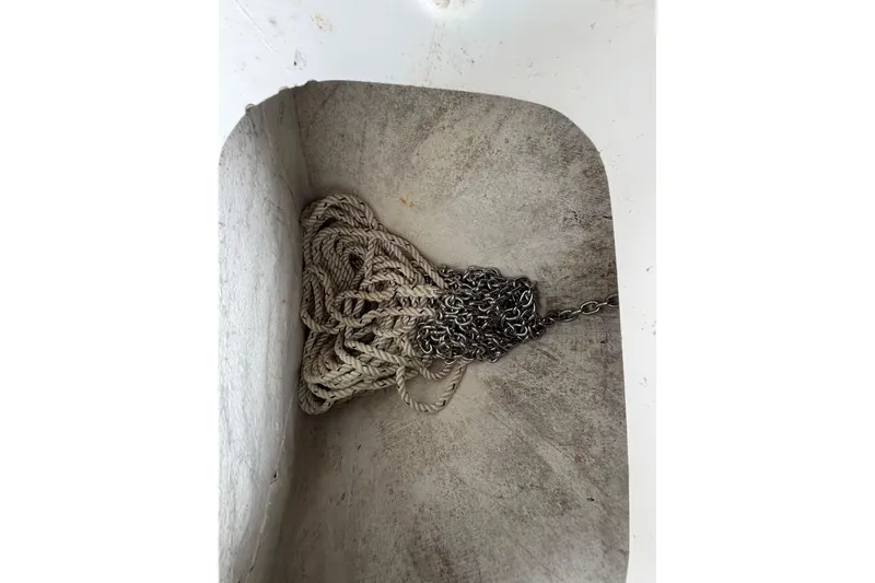 Slide: The Image of Anchor rope and chain in a 2016 Sea Hunt Gamefish 25 storage compartment. - 44