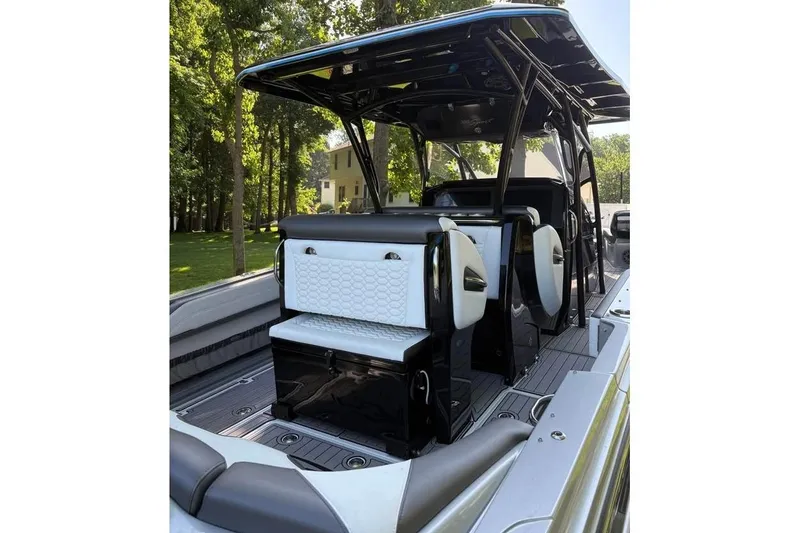 Slide: The Image of 2022 Nor-Tech 390 Sport Center Console boat interior with sleek seating and modern design. - 7