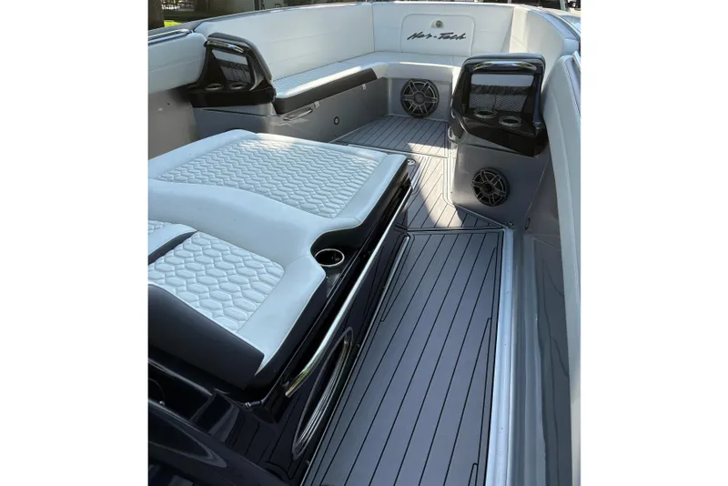 Slide: The Image of 2022 Nor-Tech 390 Sport Center Console interior with sleek seating and modern design. - 8