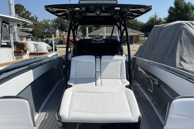 Slide: The Image of 2022 Nor-Tech 390 Sport Center Console with luxurious seating and sleek design. - 9