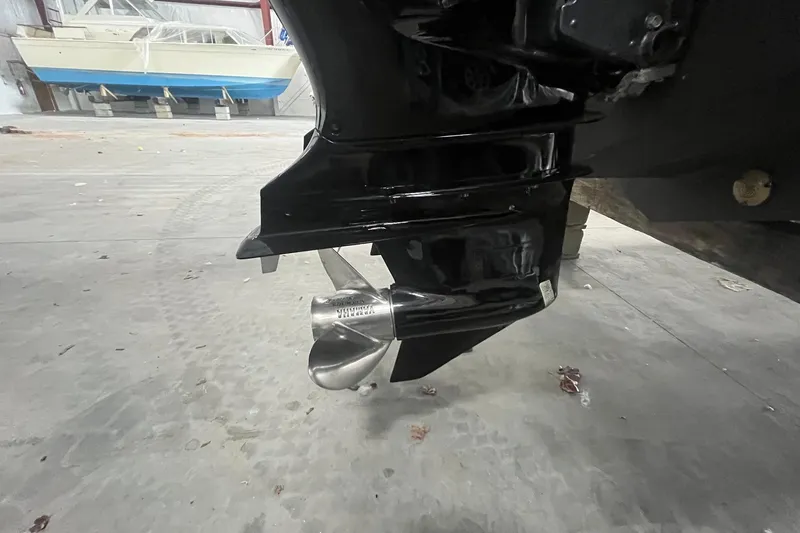 Slide: The Image of Close-up of a 2017 Scout 320 LXF boat propeller in a garage setting. - 12