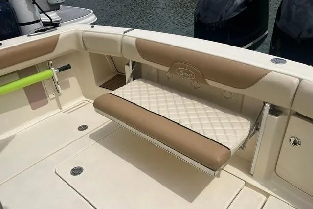Slide: The Image of 2017 Scout 320 LXF boat interior with cushioned seating and elegant design. - 25