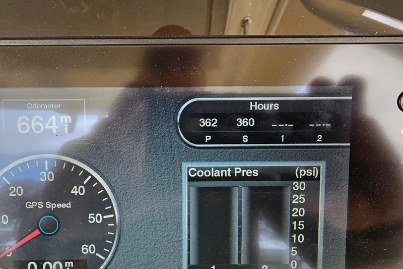Slide: The Image of Dashboard display of a 2017 Scout 320 LXF showing odometer, hours, and coolant pressure. - 37