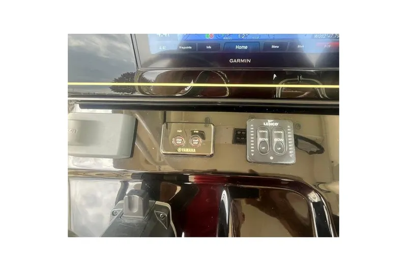Slide: The Image of Control panel of a 2017 Scout 320 LXF boat featuring Garmin and Yamaha systems. - 38