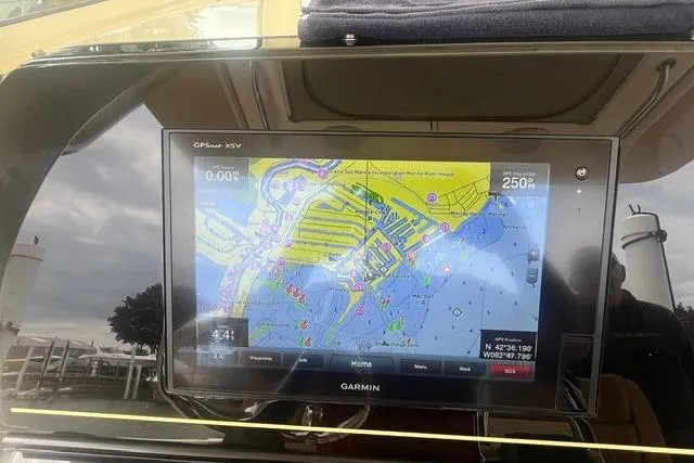 Slide: The Image of Garmin GPS display on 2017 Scout 320 LXF boat, showing nautical map and navigation details. - 39
