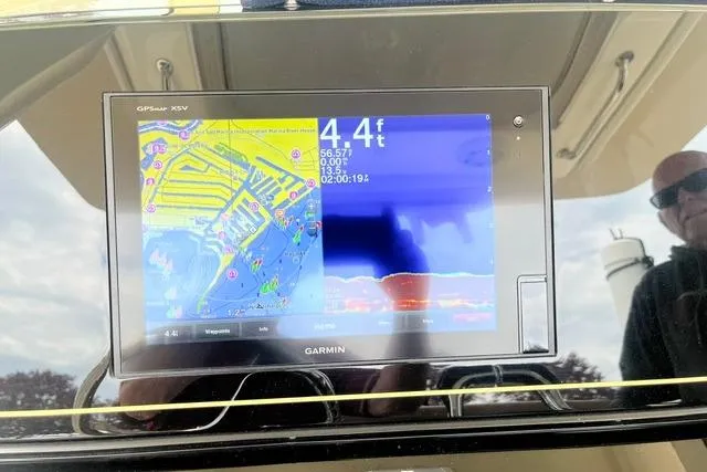 Slide: The Image of Garmin GPS display on 2017 Scout 320 LXF boat dashboard showing navigation and sonar data. - 43