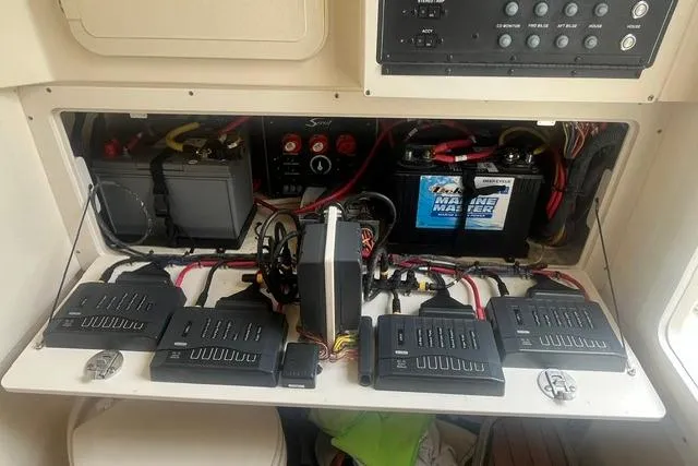 Slide: The Image of Electrical system of a 2017 Scout 320 LXF boat, featuring batteries and wiring. - 52