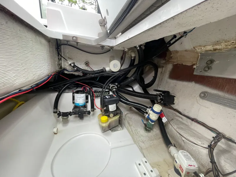 Slide: The Image of Interior view of 2022 Sportsman Masters 247OE Bay Boat wiring and components. - 19