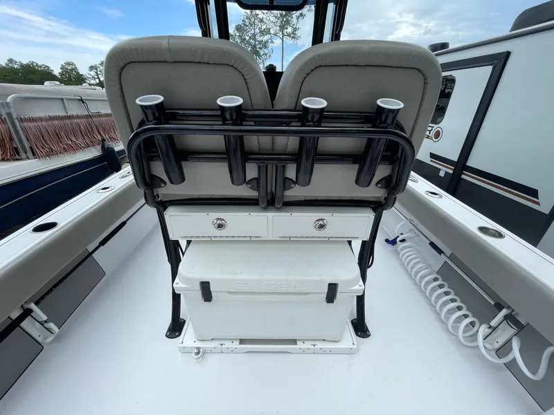 Slide: The Image of 2022 Sportsman Masters 247OE Bay Boat interior with seating and storage features. - 7