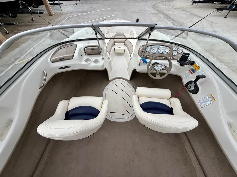 Slide: The Image of Interior of a 2006 Tracker Tahoe Q6 SF boat with steering console. - 10