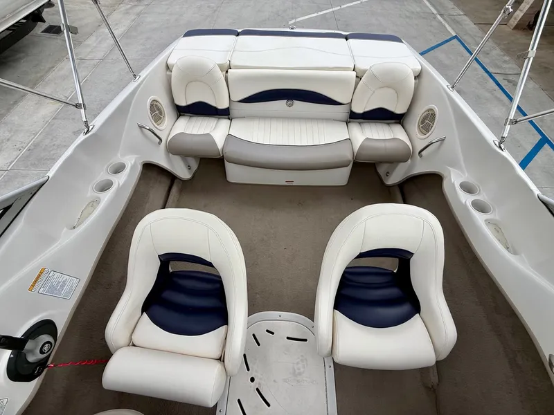 Slide: The Image of Interior of a 2006 Tracker Tahoe Q6 SF boat with white seating. - 12