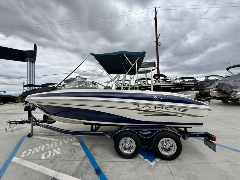 Slide: The Image of 2006 Tracker Tahoe Q6 SF boat on trailer, cloudy sky. - 3