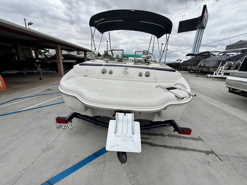 Slide: The Image of 2006 Tracker Tahoe Q6 SF boat on trailer outdoors. - 4