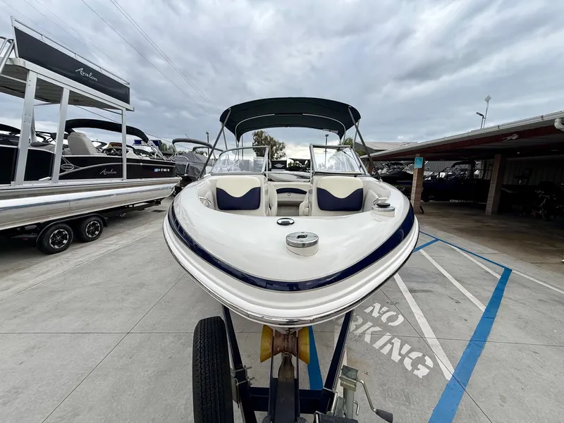 Slide: The Image of 2006 Tracker Tahoe Q6 SF boat on trailer outdoors. - 5