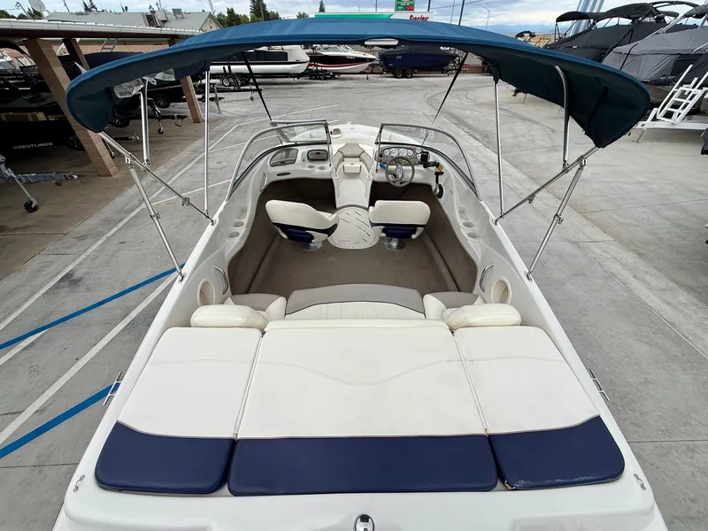 Slide: The Image of 2006 Tracker Tahoe Q6 SF boat with bimini top and seating area. - 7
