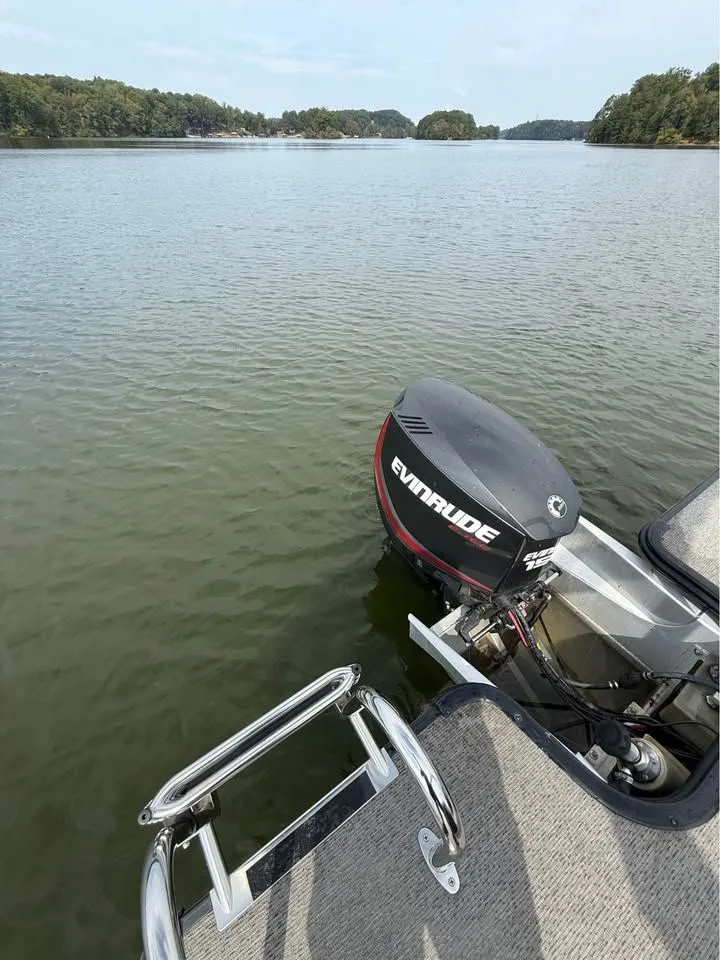 Slide: The Image of Starcraft SLS-3 boat with Evinrude motor on calm lake, 2018 model. - 6