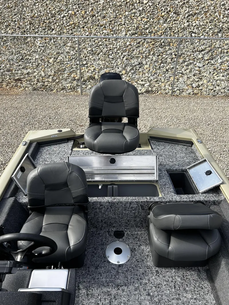 Slide: The Image of 2026 Tracker Pro Team 175 boat with black seats and gray carpet. - 12