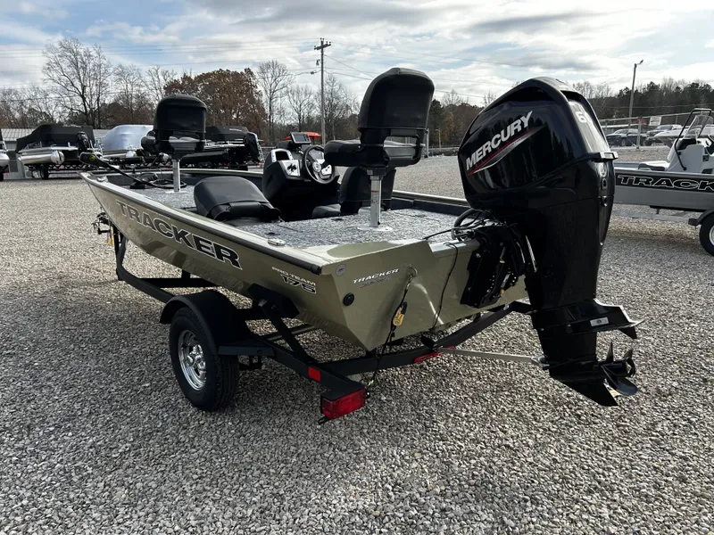 Slide: The Image of 2026 Tracker Pro Team 175 boat with Mercury engine on gravel lot. - 6