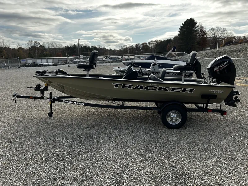 Slide: The Image of 2026 Tracker Pro Team 175 boat on trailer outdoors. - 8