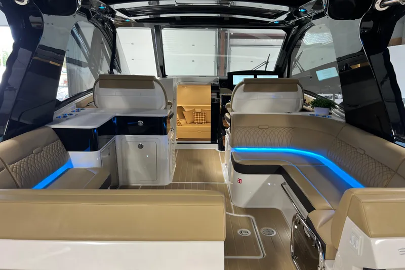 Slide: The Image of Luxurious interior of 2025 Sea Ray Sundancer 370 Outboard with modern seating and ambient lighting. - 10
