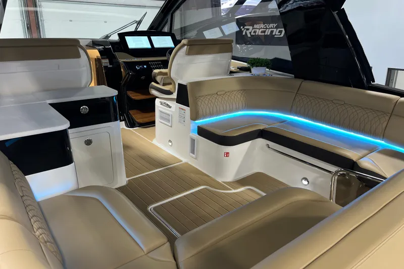 Slide: The Image of Luxurious interior of 2025 Sea Ray Sundancer 370 Outboard with modern seating and ambient lighting. - 11
